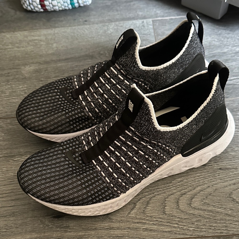 Nike Women’s Black and White Athletic Slip-Ons